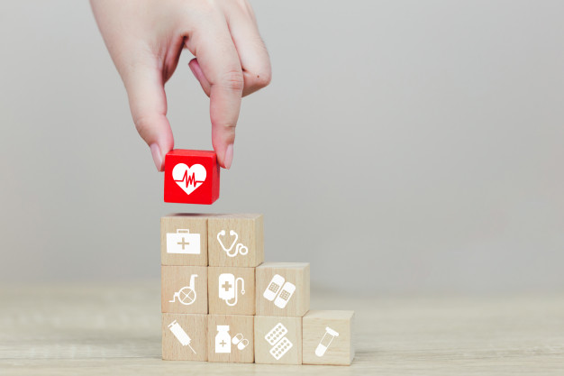 health-insurance-concept-hand-arranging-wood-block-stacking-with-icon-healthcare-medical_34936-2155